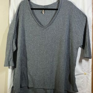 Grey medium weight ribbed sweater.
